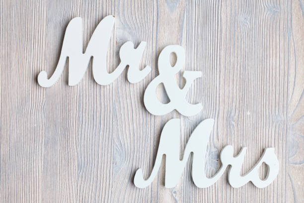 istock Letters mr and mrs on a wooden background. Top view. 1220539581