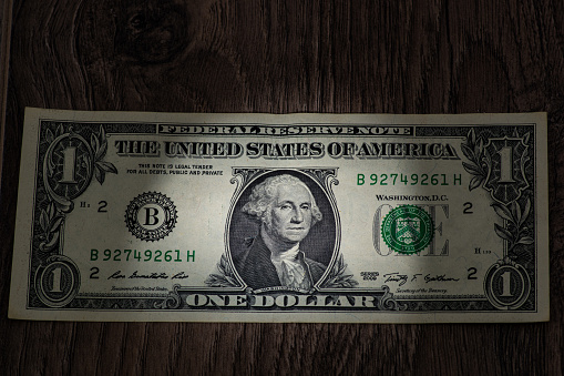 Hundred dollars bill fragment on macro, fragment of new 100 dollar with sunlight. 100. New sample money