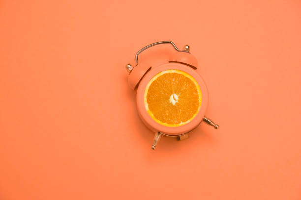 istock flat lay creative art collage alarm clock and orange copy space 1220540233