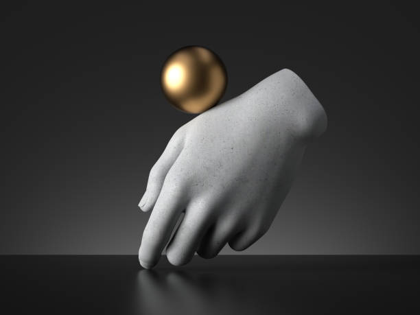 istock 3d render, golden ball balancing on mannequin hand, isolated on black background, magical trick modern minimal concept, simple clean design. Human limb prosthesis. Concrete sculpture art object 1220540337