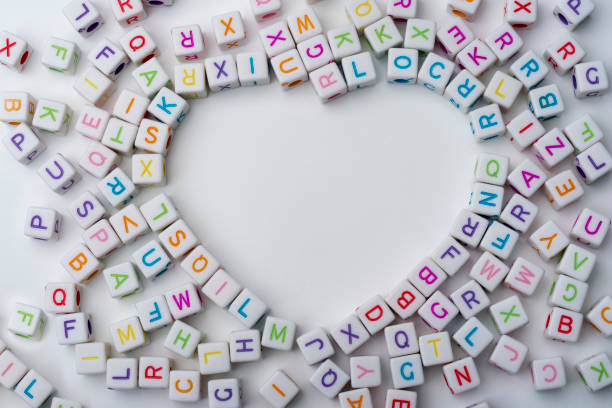 istock Many colorful decorative cubes with letters on a white background. 1220540532