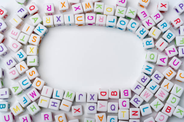 istock Many colorful decorative cubes with letters on a white background. 1220540539