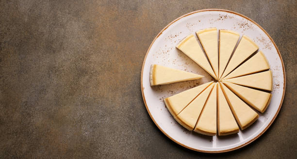 istock Classic vanilla cheesecake cut into pieces. Top view, copy space 1220540628