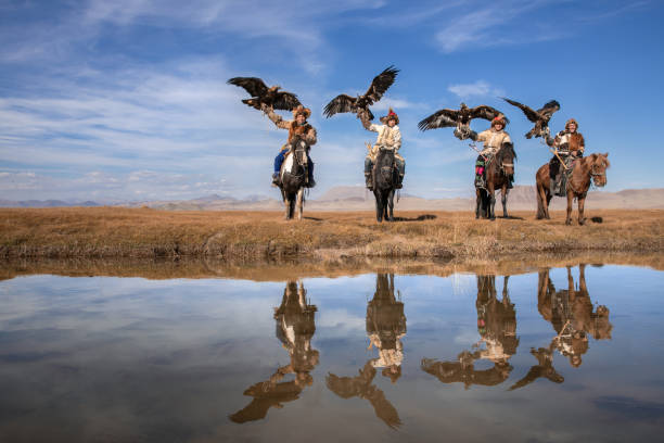 istock Group portrait of four kazakh eagle hunters. 1220541407