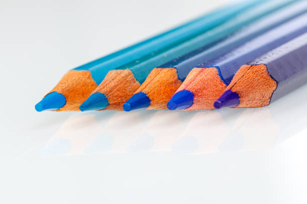istock blue and violet pencil on white background 1220543320