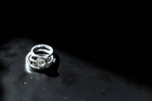istock 3 wedding gold rings on the black background. Wedding. 1220543848