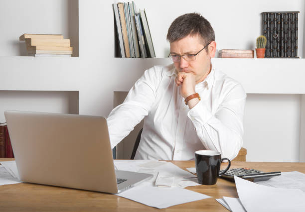 istock Businessman working on Desk at home office business 1220545433