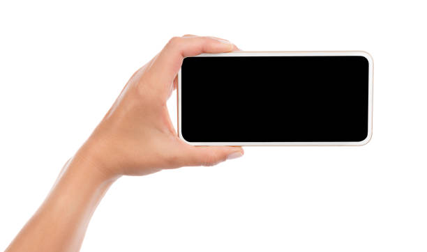 istock Female hand holding mobile smart phone with blank screen isolated on white background. 1220545442
