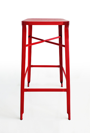 Front view of red metal leg stool isolated on white background. Square high chair ideal for hotels, bars, kitchens, functional and modern design.