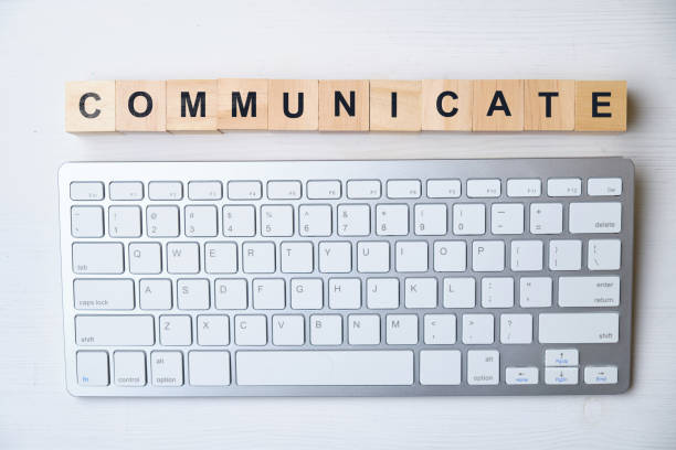 istock Modern business buzzword - communicate. Top view on wooden table with blocks. Top view. 1220545760