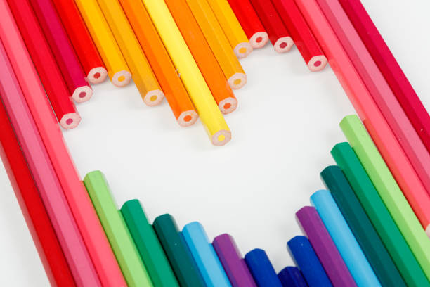 Multicolored pencils in the form of a heart close-up