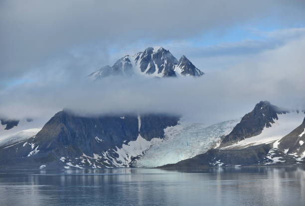 istock Fog and low clouds over the fjord mountains. 1220547327