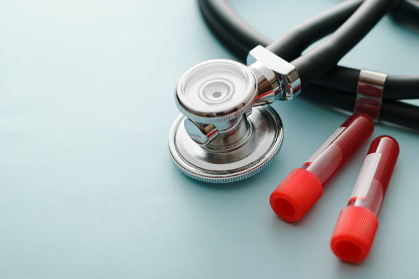 istock Lab test tubes with blood samples and stethoscope 1220547474