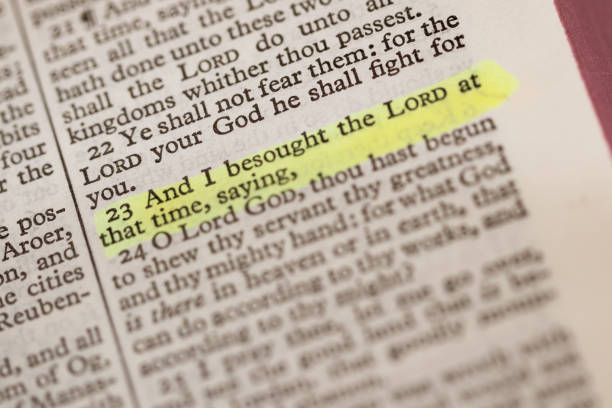 istock Close up abstract macro image of a highlighted text from a page from the bible. 1220547500