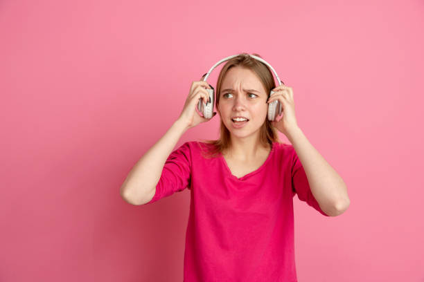 istock Caucasian young woman's monochrome portrait on pink studio background, emotinal and beautiful 1220548651