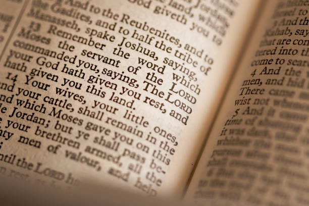 istock Close up abstract macro image of a page from the bible. 1220548743