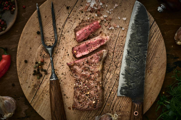 istock Grilled beef steak with spices. Top view 1220550988