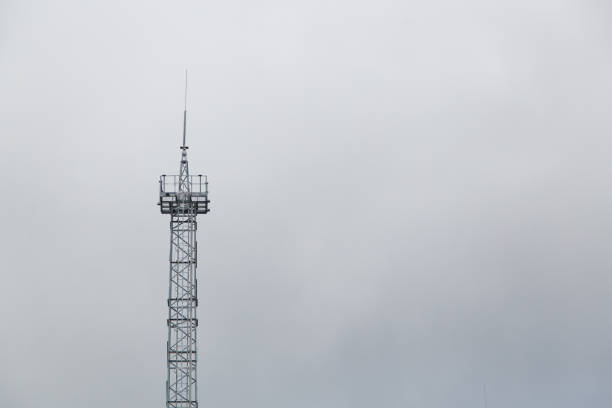 The post the transmission of cellular data on the sky background. Telecommunications tower for cellular communications.