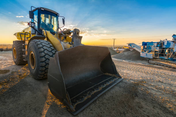 istock Excavator working on a construction site at the end of the day 1220553123