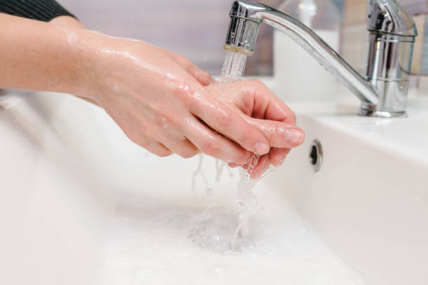 istock Coronavirus prevention. Wash hands with antibacterial soap, warm water rubbing nails and fingers in sink. Washing hands and hygiene. Covid-19. Prevention of flu disease. To stop spreading coronavirus. 1220553230