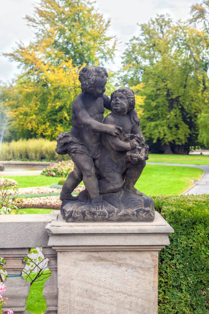istock Statue with two babies, landscape sculpture 1220555146