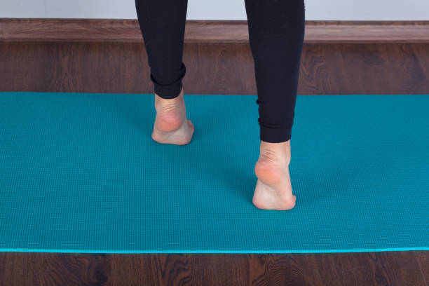 istock exercising woman in carpet 1220557089