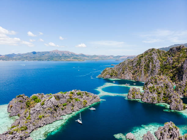 istock Surfing in Duli beach, El Nido, Palawan 1220558015