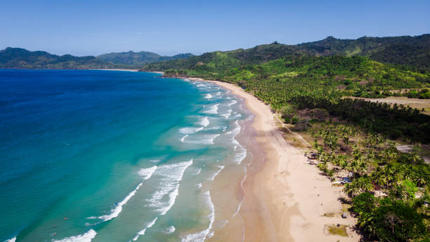 istock Surfing in Duli beach, El Nido, Palawan 1220558159