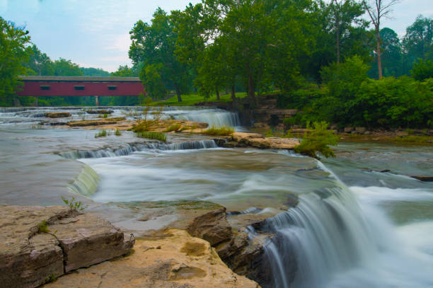 istock Waterfall-Cataract Falls-with covered bridge- On Mill Creek-Owen County Indiana 1220558511