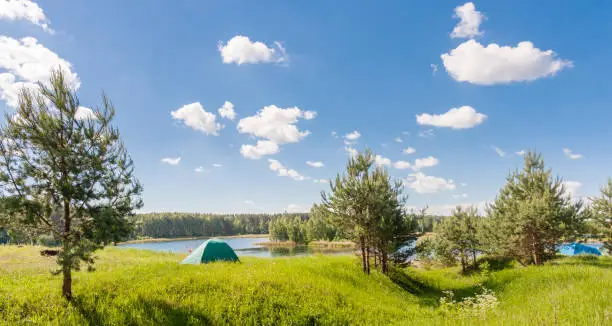 Tent on the lake in summer in Russia