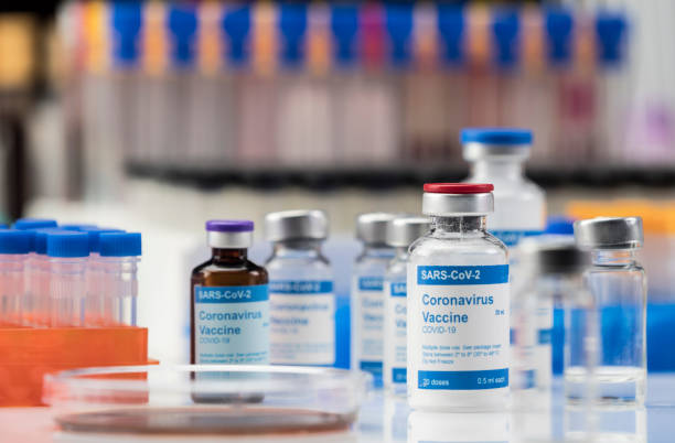 istock Coronavirus covid-19 experimental vaccine in a laboratory, conceptual image 1220560228