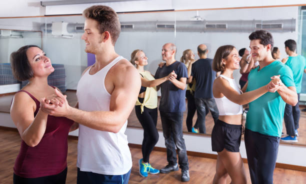 istock Men and women dancing salsa o bachata 1220562343