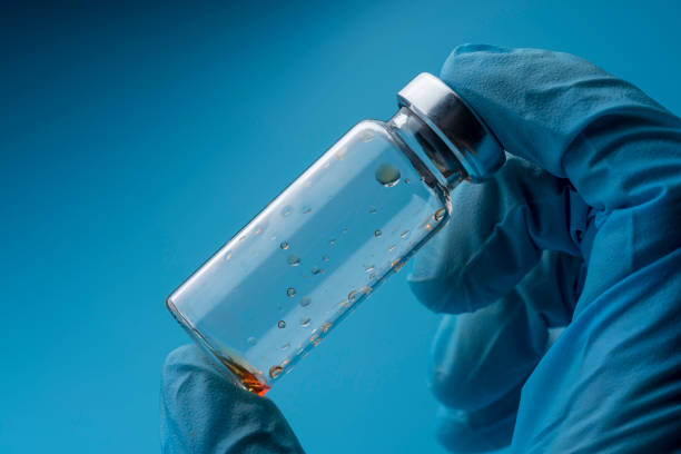 istock A gloved hand holds an empty medical bottle. 1220562804