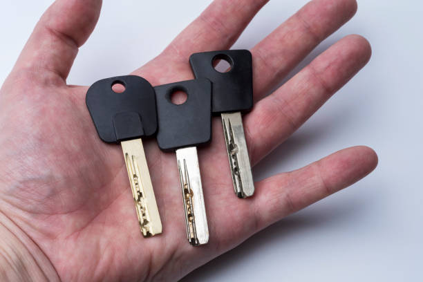 istock Set Of Keys On Human Palm Isolated On White Background 1220562918