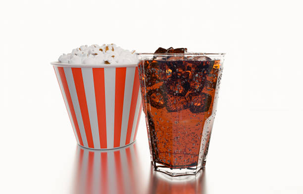 istock Cola glass with ice cubes and POPCORN in Popcorn Bucket  on a white background and reflection. cola with crushed ice in glass and there is water droplets around. cool black fresh drink. 3D rendering. 1220563106