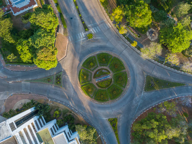 istock Top down aerial view of a traffic roundabout 1220563998