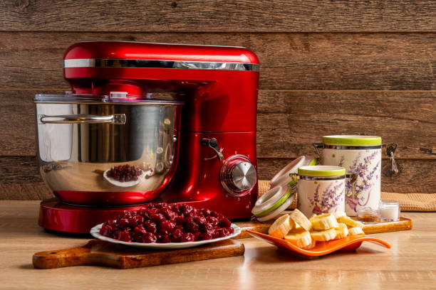 istock Stand mixer and ingredients for making muffin batter with sour cherries 1220564187