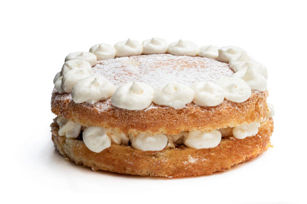 Victoria sponge cake with whipped cream on top isolated on white