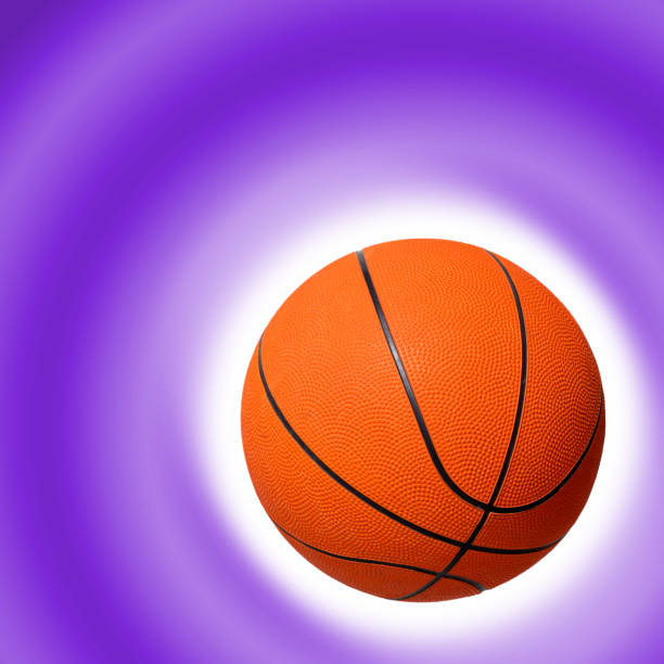 istock Basketball on a purple color gradient background 1220566083
