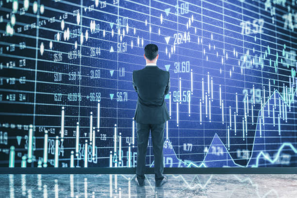 istock Businessman looking to creative business chart 1220566731