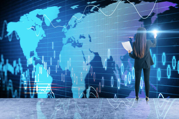 istock Businesswoman drawing glowing stock analytics 1220568071