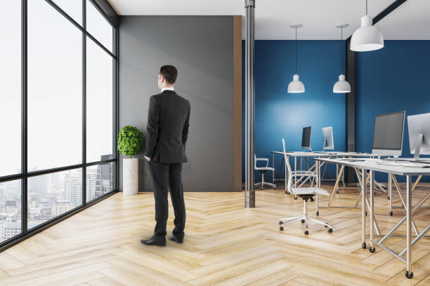 istock Businessman in coworking office interior 1220568153
