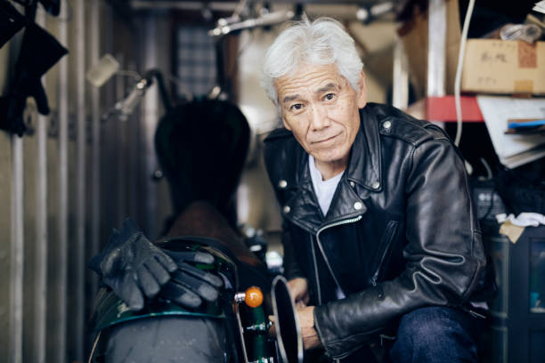 istock Senior Man Repairing a Motorcycle 1220568447