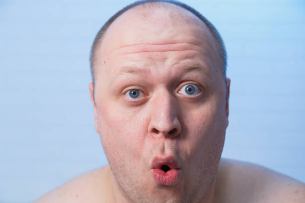 istock The bald man turned his lips away 1220568470