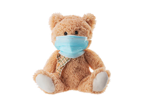 istock Teddy bear toy with protective mask. Protective from virus covid-19 1220570135