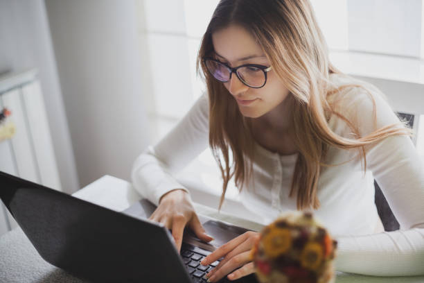 istock Young woman working from home during covid-19 crises 1220570179