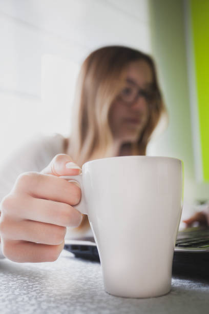 istock Young woman working from home during covid-19 crises 1220570352
