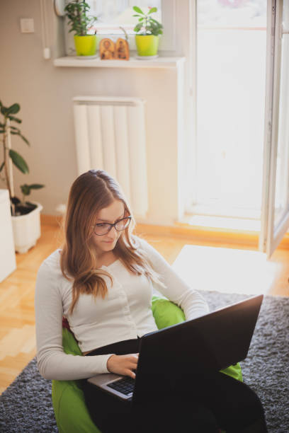 istock Young woman working from home during covid-19 crises 1220573552