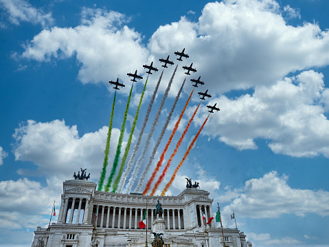 Italian National Republic day Air show aerobatic team frecce tricolore flying over altare della patria in Rome, Italy