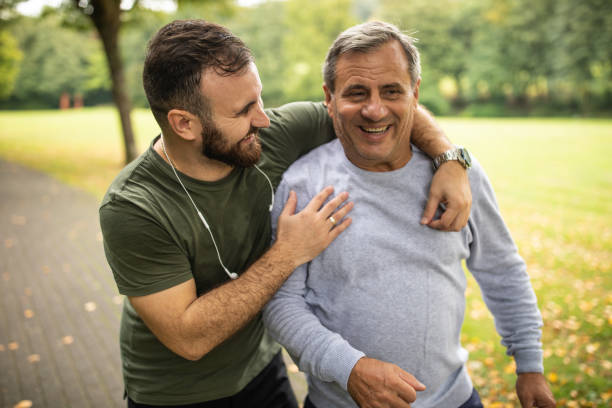 istock Father and son spending active weekend morning together at public park 1220575278